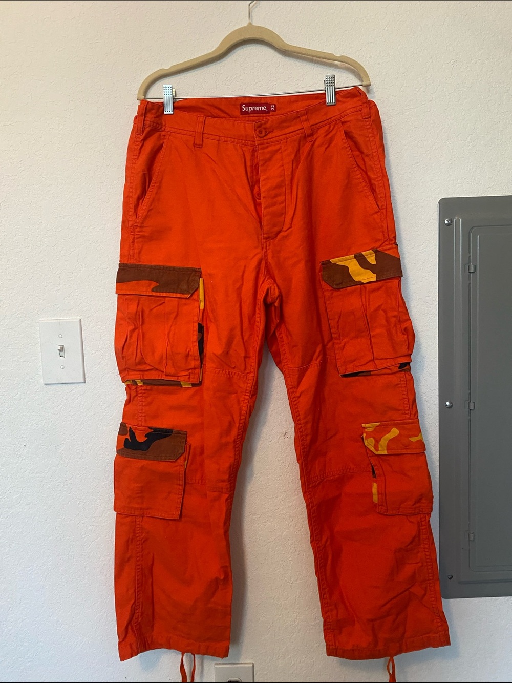 Supreme Orange Cargo Pants with Camo Pocket Accents